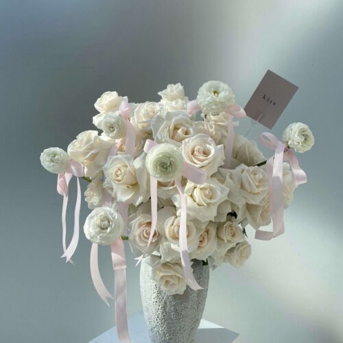 Alternative view of cream caresses vase arrangement