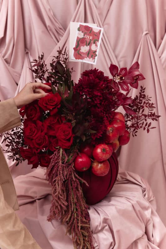 Elegant red flower bouquet with roses, dahlias, and apples for Garnet No. 9.