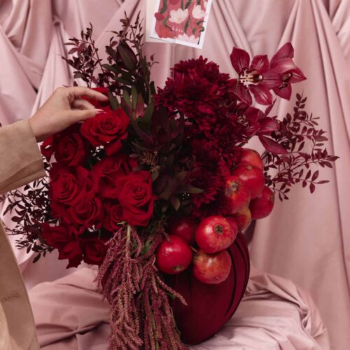 Elegant red flower bouquet with roses, dahlias, and apples for Garnet No. 9.