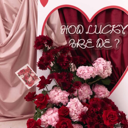 Queen of My Heart floral display with roses and carnations.