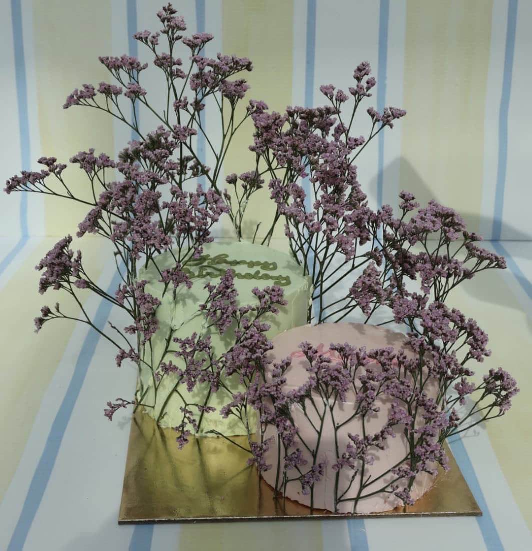 Beautiful purple flowers arranged in vases, perfect for home decor or special occasions, showcasing fresh and vibrant floral designs.